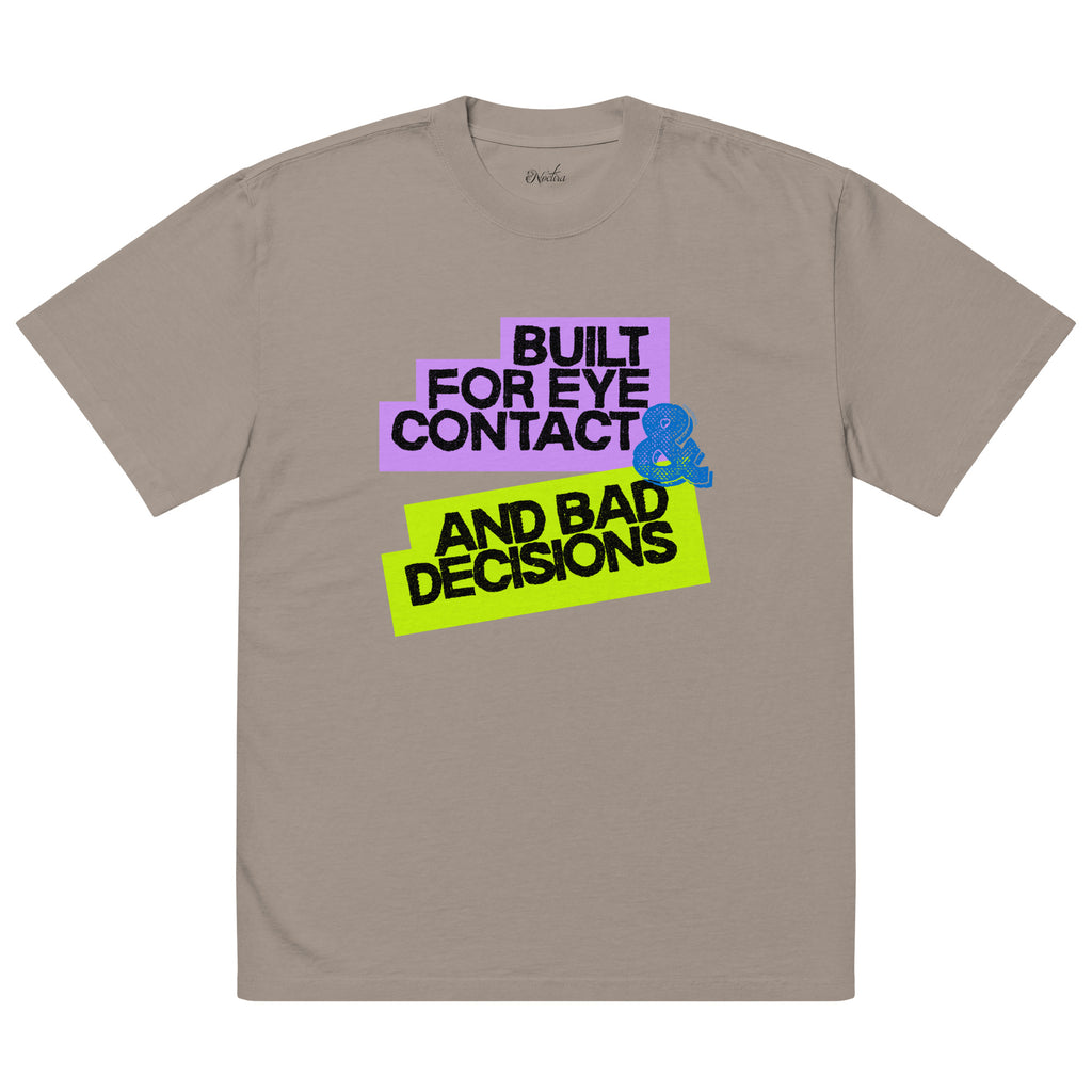 Beige t-shirt with colorful text and graphic on a white background