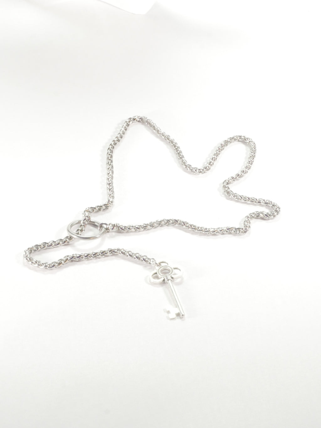 Silver chain necklace on a white background