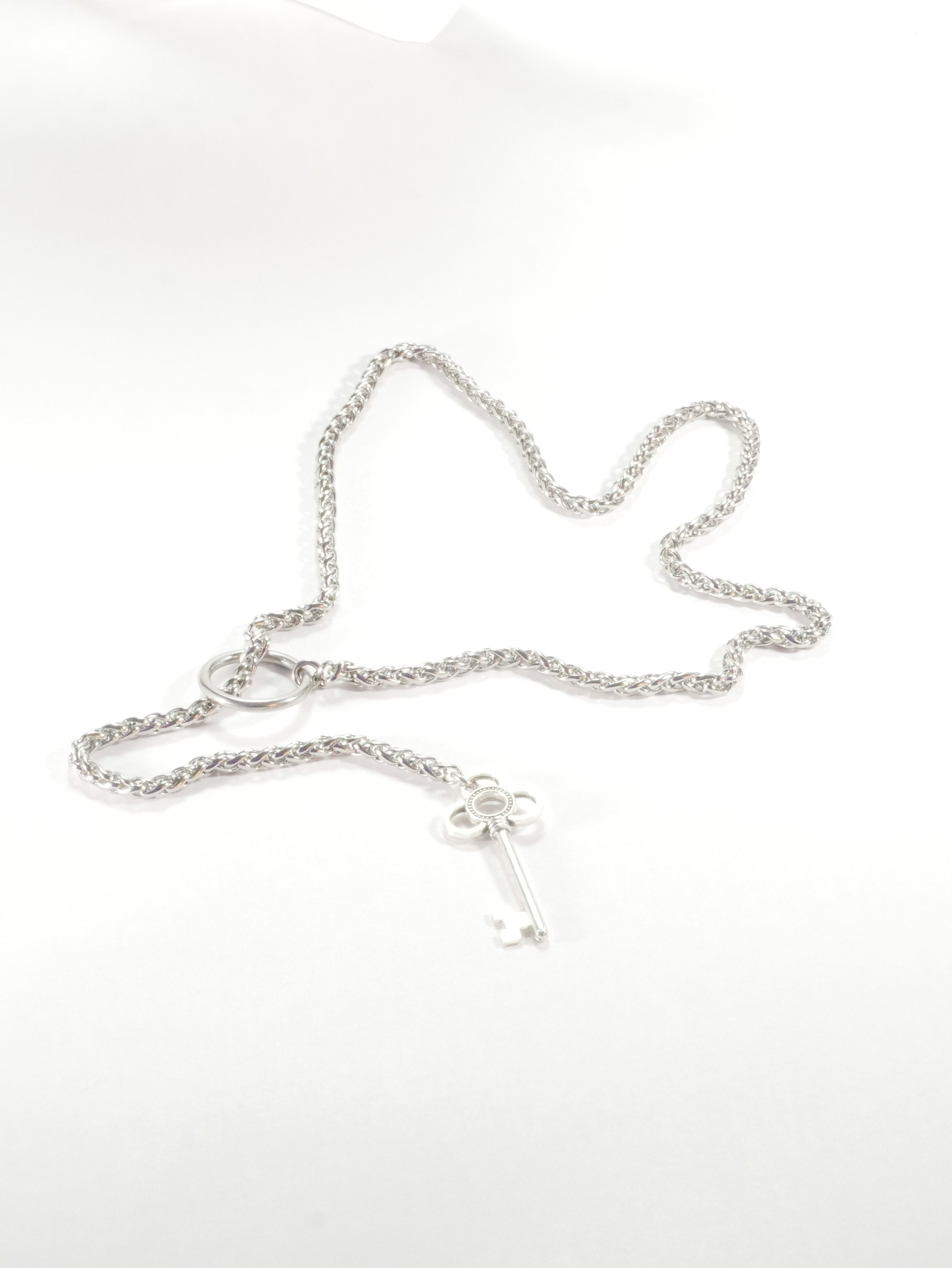 Silver chain necklace on a white background