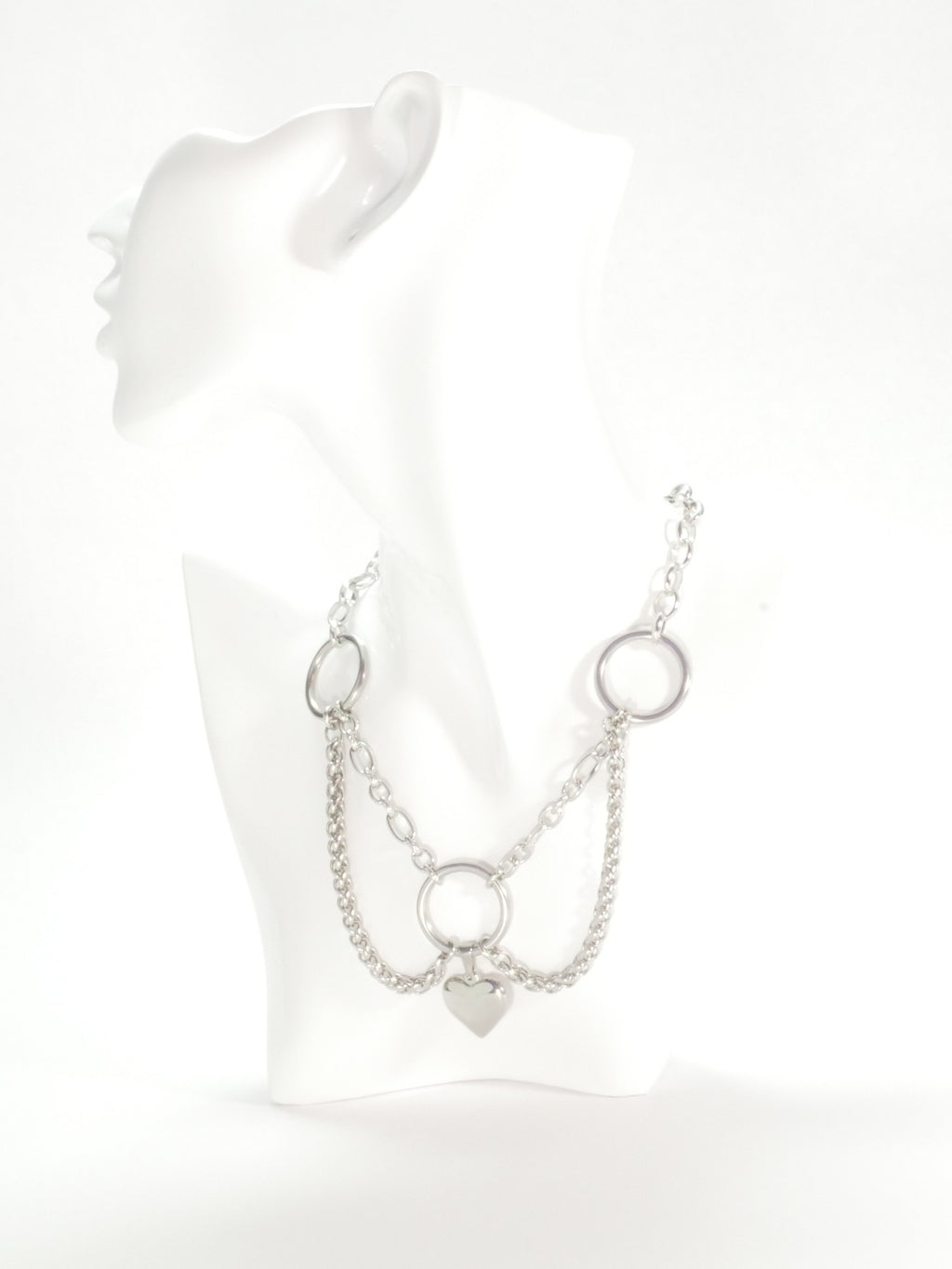 Silver chain necklace on a mannequin with a white background