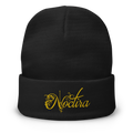 Black beanie with yellow 'Noctira' logo on a white background