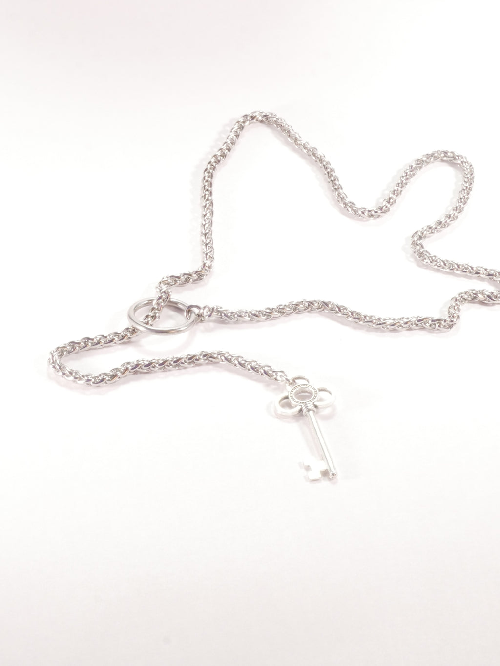 Silver chain necklace on a white background