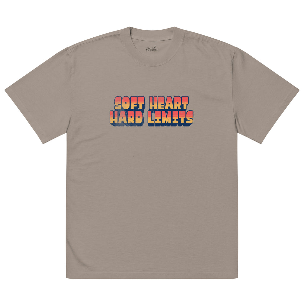 Beige t-shirt with colorful text 'SOFT HEART HARD LIMITS' on a white background