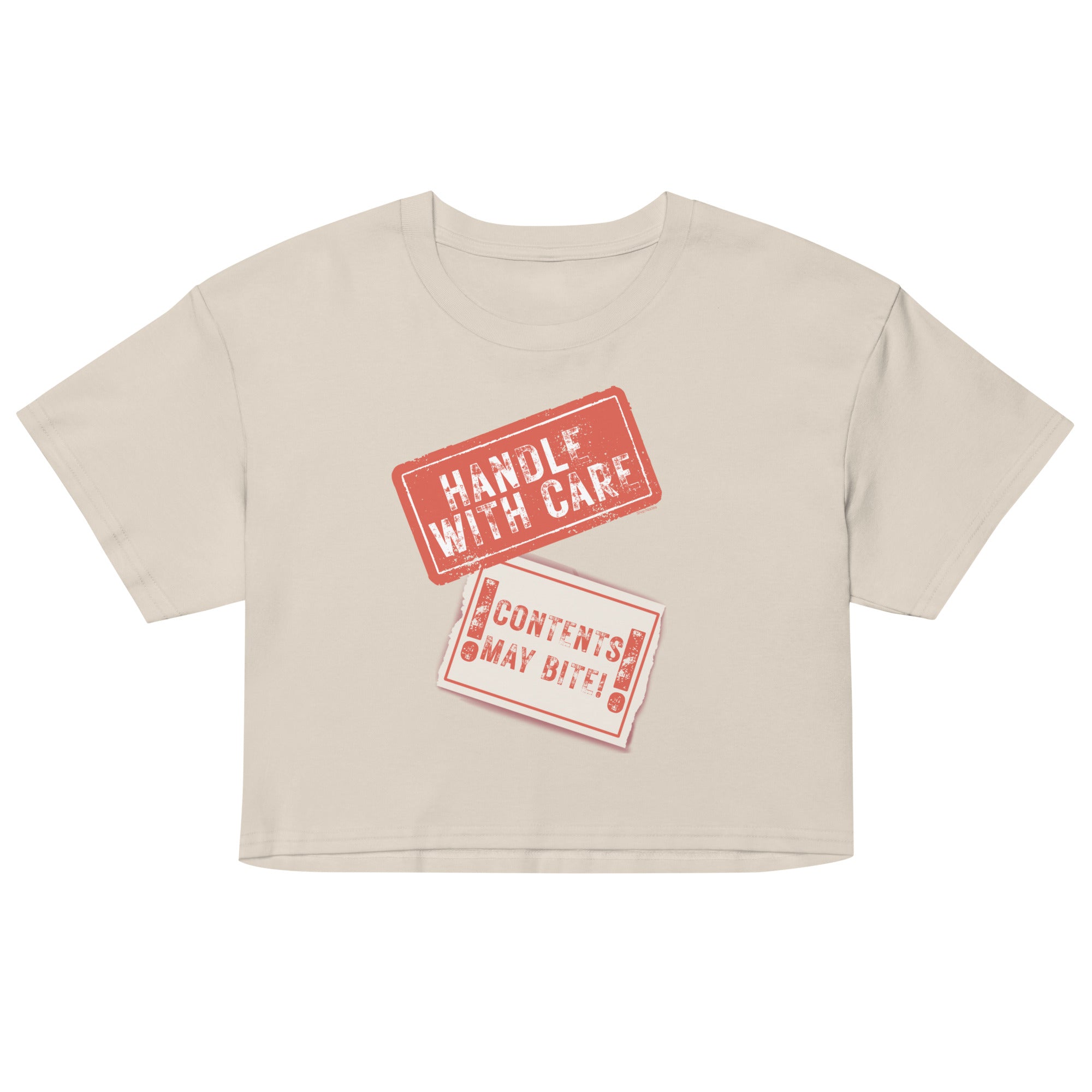 Beige crop top with red 'Handle with Care' and 'Contents May Vary' text on a white background