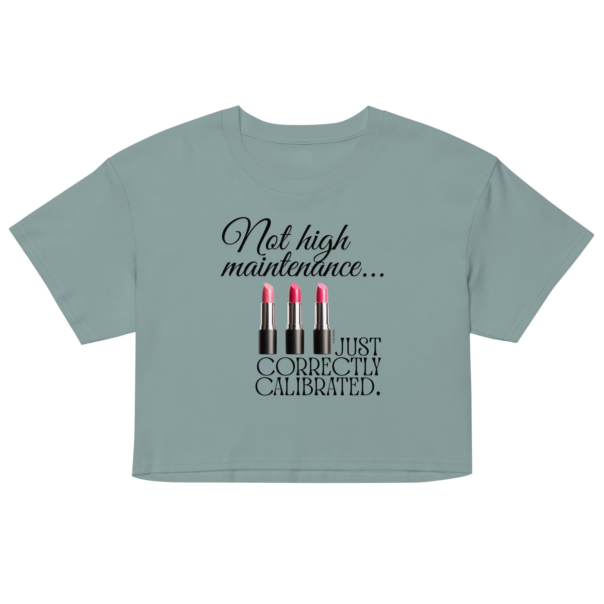 Light blue crop top with graphic of lipsticks and text on a white background