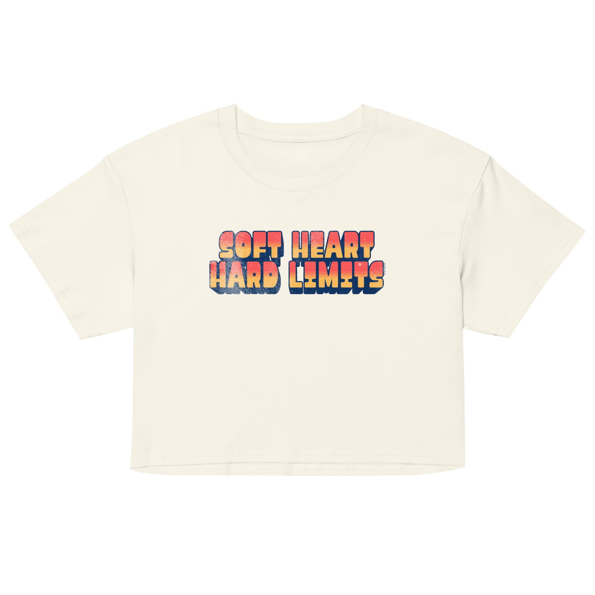 Beige t-shirt with colorful 'Soft Heart Hard Limits' text on a white background