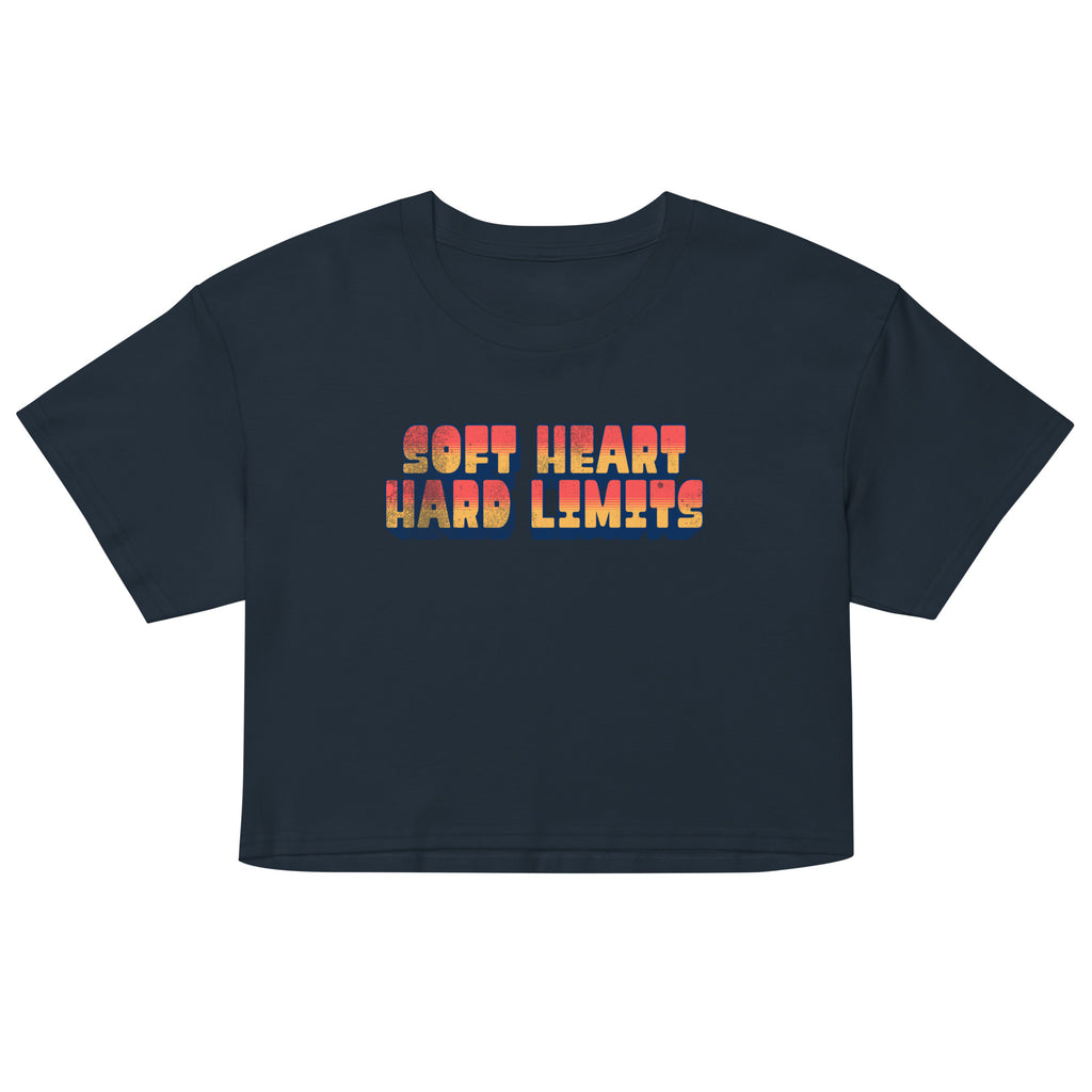 Black crop top with colorful text 'SOFT HEART HARD LIMITS' on a white background