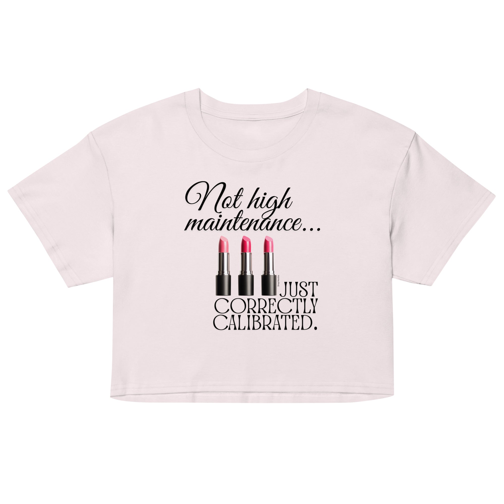 Pink crop top with black text and lipstick graphics on a white background