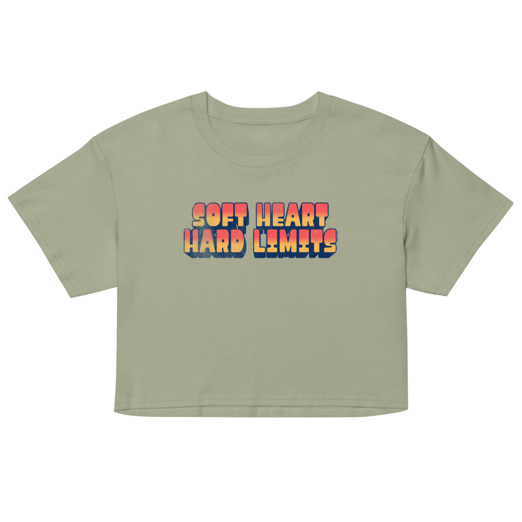 Sage green crop top with 'Soft Heart Hard Limits' text in colorful letters on a white background
