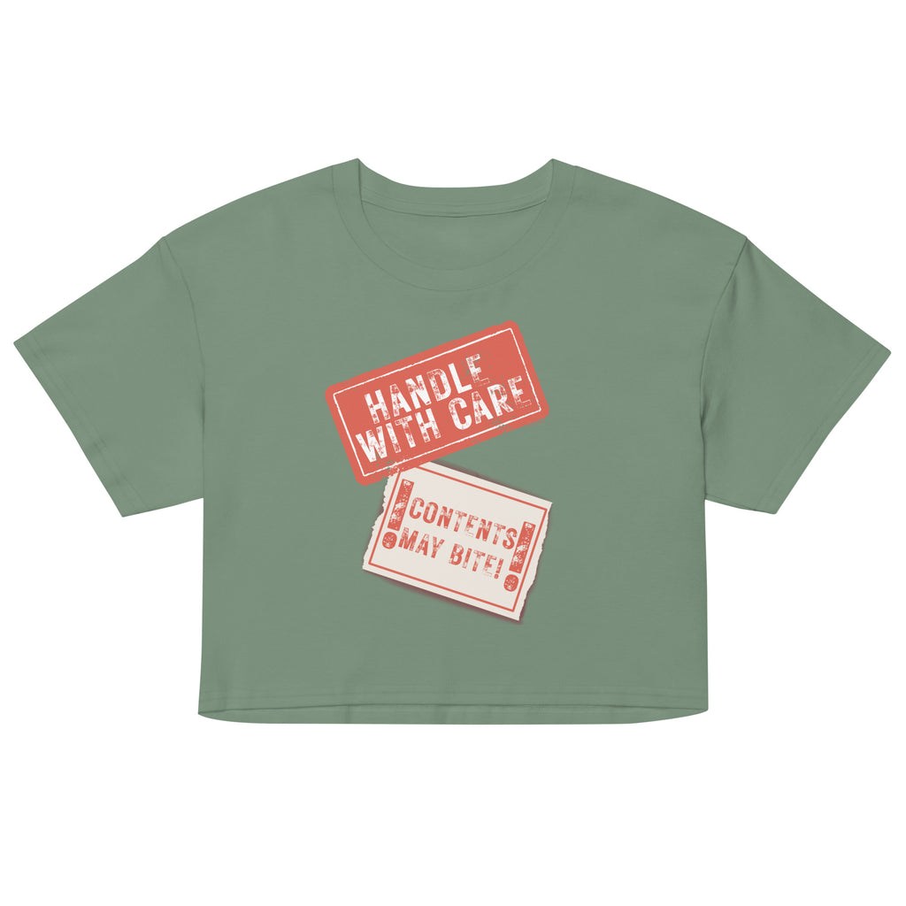 Green crop top with 'Handle with Care' and 'Contents May Vary' text on a white background
