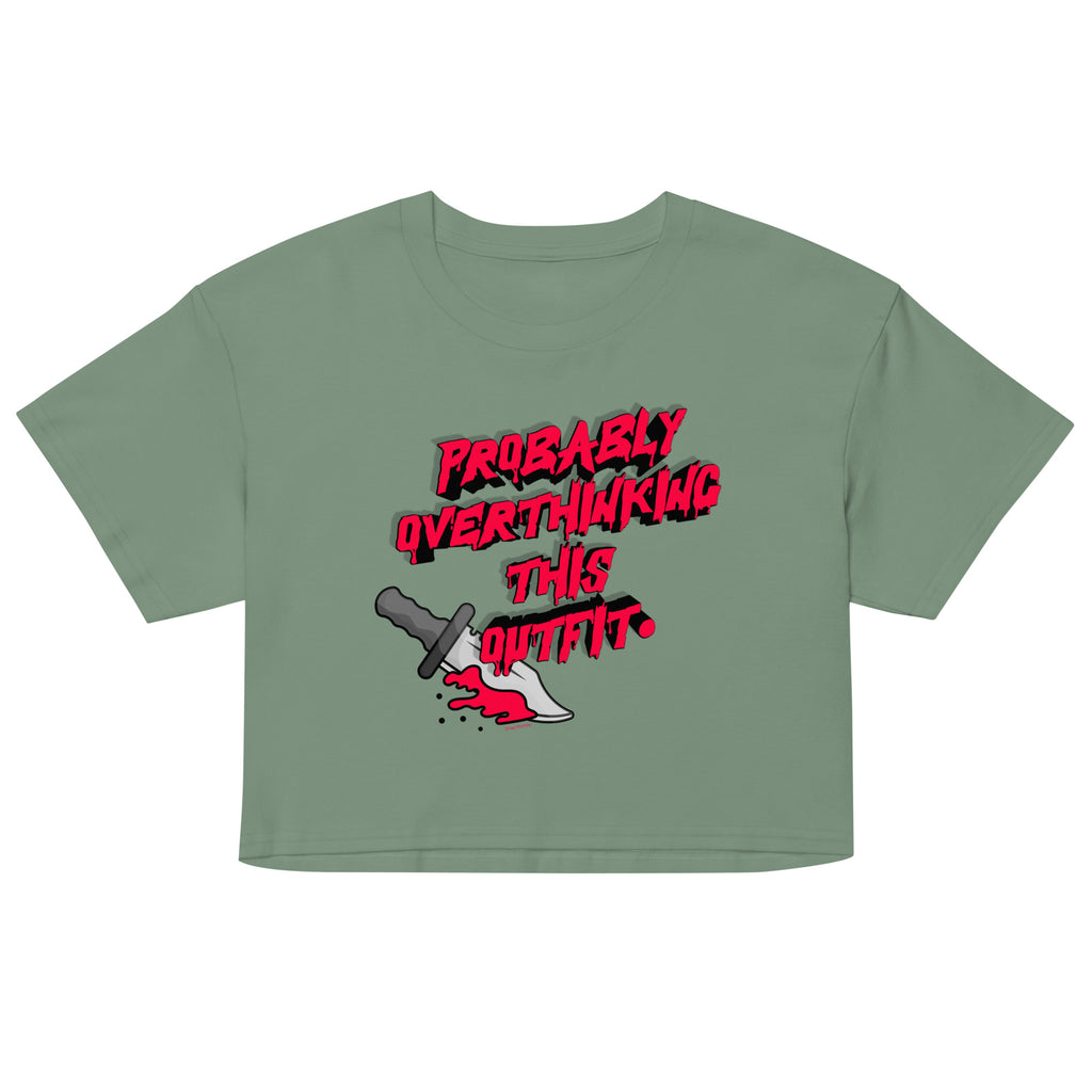 Green crop top with red and black graphic text and dagger illustration on a white background