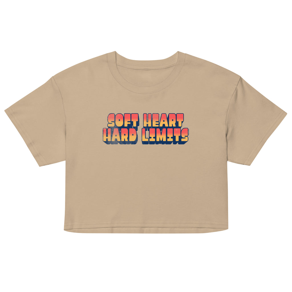 Beige crop top with colorful 'Soft Heart Hard Limits' text on a white background